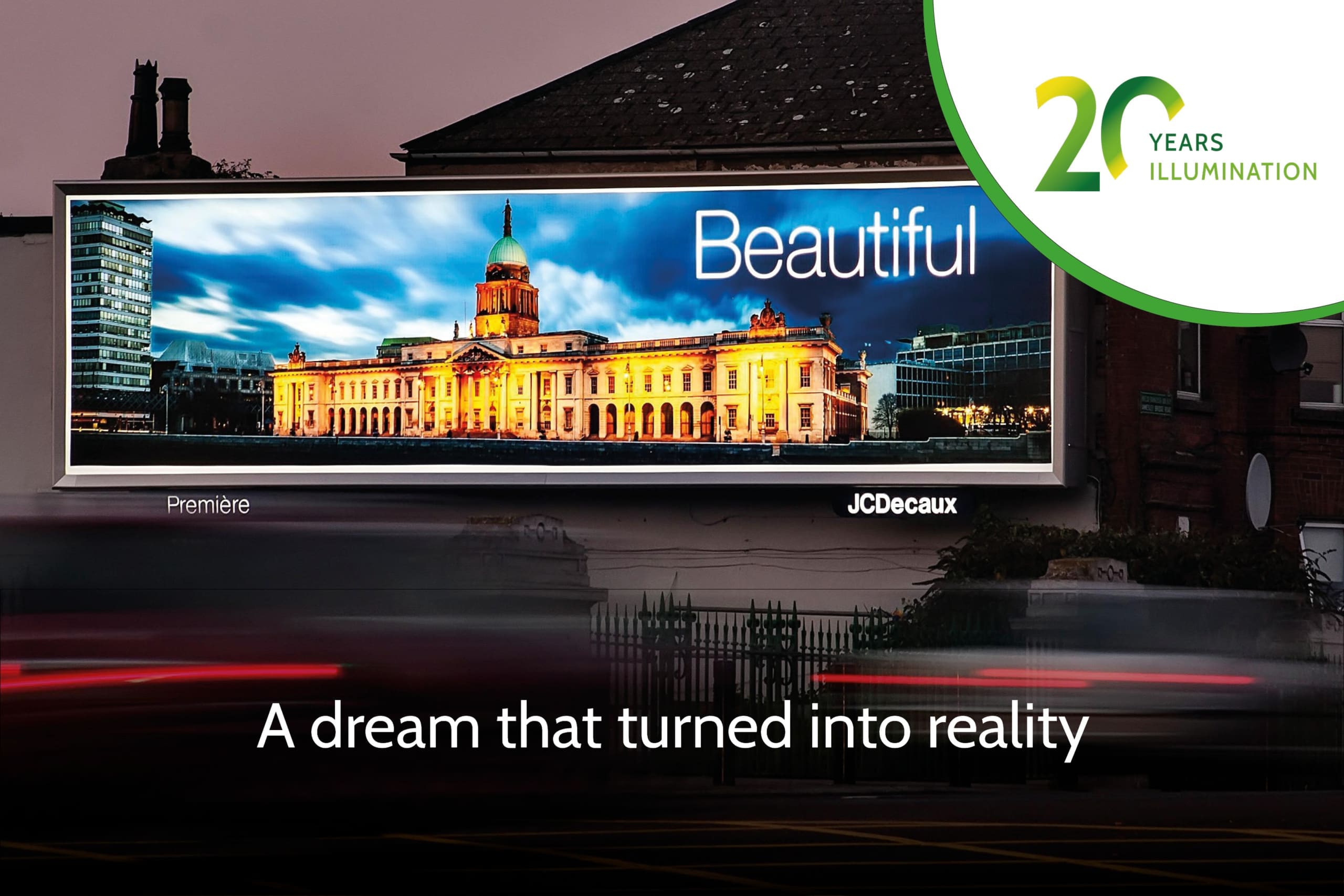 A large, backlit illuminated billboard at night showcases a beautifully lit historic building with a dome. The LED backlit display proudly reads "Beautiful" with the text below stating, "A dream that turned into reality." In the top right corner, a logo celebrates "20 Years Illumination.